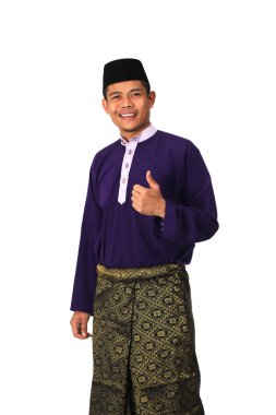 Asian muslim male with traditional Malay costume in thumb up clipart