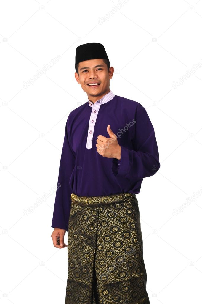Asian muslim male with traditional Malay costume in thumb up