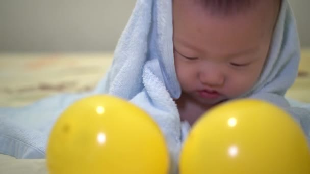 Asian Baby Play Towel Front Two Yellow Ball Parenthood Baby — Stock Video