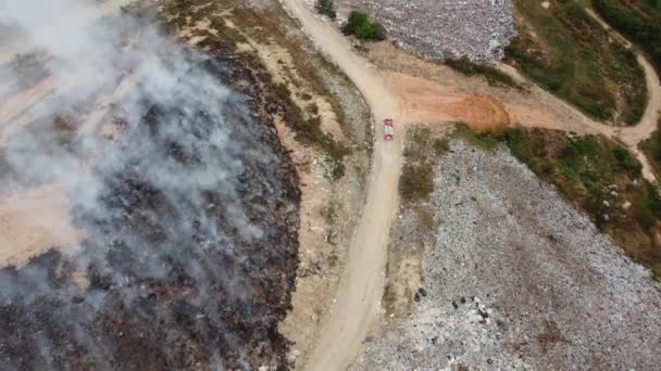 Aerial View Fire Engine Move Path Fire Garbage Dump Site — Stockvideo