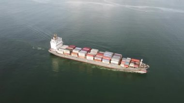 Georgetown, Penang, Malaysia - Jun 12 2022: Aerial look down container vessel sail at sea