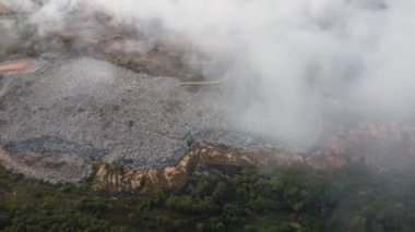 Aerial look down fire burning happen at landfill dump site
