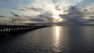 Georgetown, Penang, Malaysia - Oct 23 2021: Fly toward Penang Bridge in sun ray morning