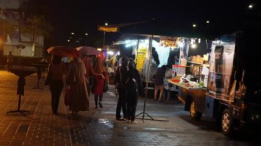 Batu Kawan, Penang, Malaysia - Nov 25 2021: People purchase dinner from food truck in night