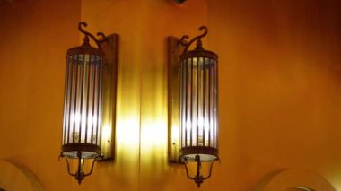 Tilt down lighting old lamp at wall in chinese Temple.