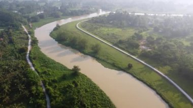 Aerial move over river Sungai Perai in misty morning