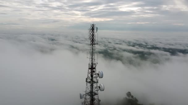 Aerial Tracking Rotate Follow Telecommunications Tower Foggy Low Cloud Morning — Vídeo de stock