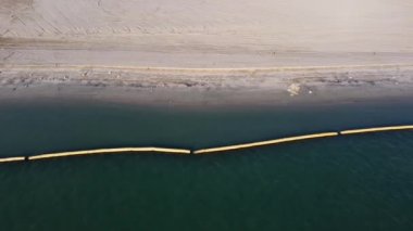 Aerial view barrier at sea near the reclamation land
