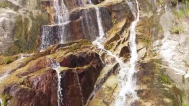 Slow move toward waterfall from high