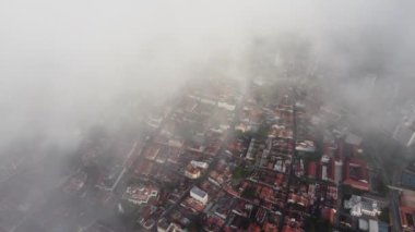 Aerial view Unesco heritage town house covered by low cloud