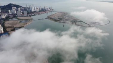 Aerial view Seri Tanjung Pinang reclamation island in low cloud morning