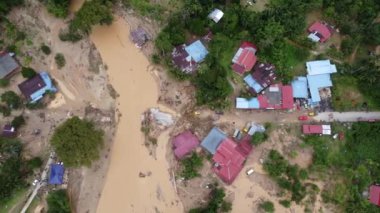 Aerial sliding and look down flash flood disaster break the bridge and road in Malaysia