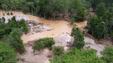 Aerial view car is flush away near rural area during flash flood