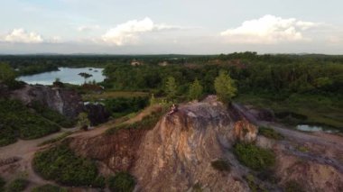 Seberang Perai, Penang, Malaysia - Nov 30 2021: Aerial view family rest at the top of abandoned quarry site