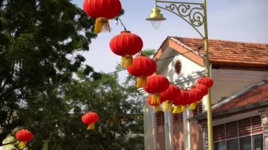 Georgetown, Penang, Malaysia - Jan 10 2022: Red lantern hanging and waving near heritage building