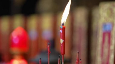 Red candle in Chines clan temple offering to ancestor