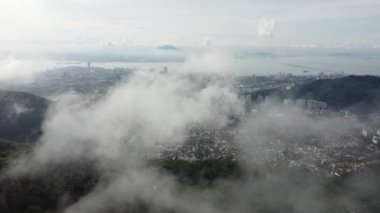 Aerial descending down and view Ayer Itam and Georgetown at background