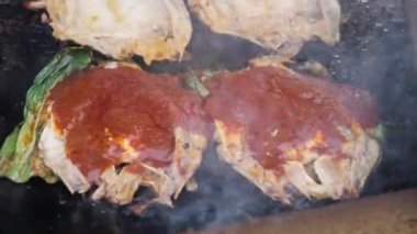 Delicious grilled fish with chilli sauce is cooked. Delicious street food
