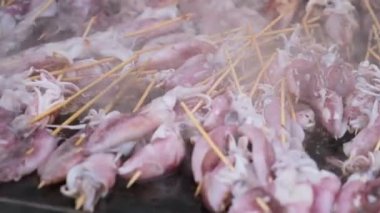 Select focus delicious squid seafood is cooked and release smoke