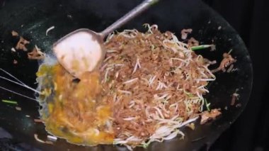 Egg is put into the Char Kuey Teow street food. Delicious Malaysia street food