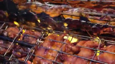 Delicious grilled chicken ayam golek is cook by rolling through fire