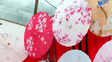 Georgetown, Penang, Malaysia - Jul 30 2022: Panning left colorful Japanse umbrella