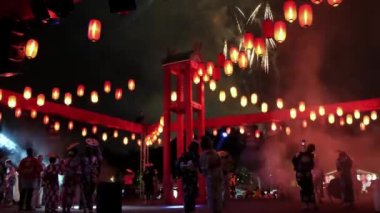 Georgetown, Penang, Malaysia - Jul 30 2022: Japanese dance stay at stage enjoy the fireworks performance during Bon Odori