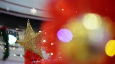 Select focus gold star decoration with red decoration. Back is bokeh led