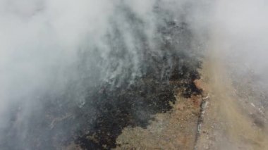 Drone shot the landfill site is burn and release smoke
