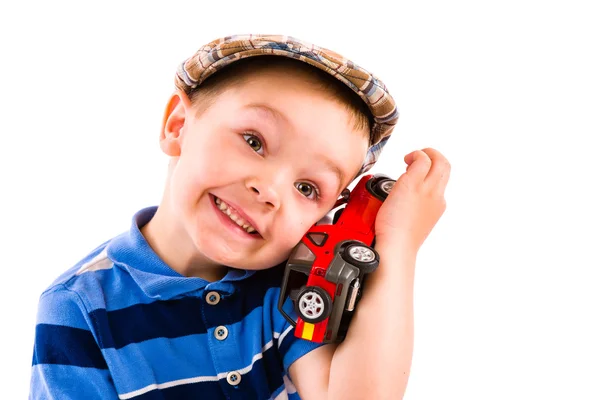 Мальчик и игрушечная машина — стоковое фото