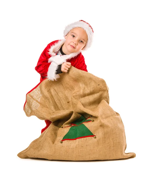 Junge und Weihnachtssack — Stockfoto