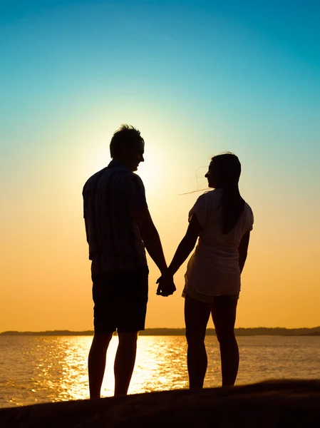 Young couple and sunset — Stock Photo, Image