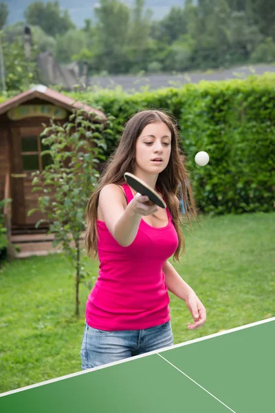girl plays ping pong