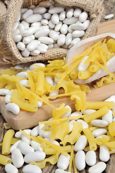 Sack of white beans and pasta — Stock Photo, Image