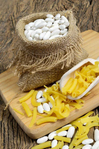 Sack of white beans and pasta — Stock Photo, Image