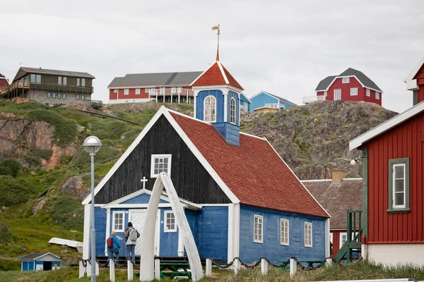 Old red and blue wooden Bethel church with whale bone arch  in Sisimiut, Greenland on 16 July 2022