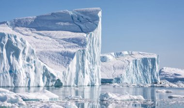 Towering great icebergs in the Ilulissat Icefjord in Greenland