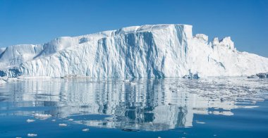 Towering great icebergs in the Ilulissat Icefjord in Greenland