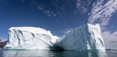 Massive towering iceberg off the Greenland coast in Disko Bay