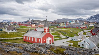 Panoramic view of Church of our Saviour - iconic red wood building and the town of Nuuk in Nuuk, Greenland on 20 July 2022
