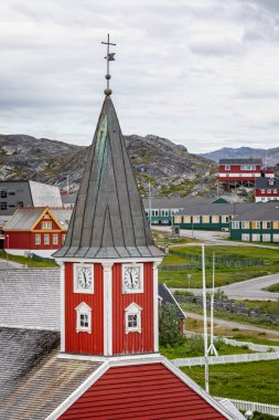 Close up of the clock tower of the iconic red wood Church of our Saviour in Nuuk, Greenland on 20 July 2022