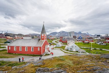 Panoramic view of Church of our Saviour - iconic red wood building and the town of Nuuk in Nuuk, Greenland on 20 July 2022