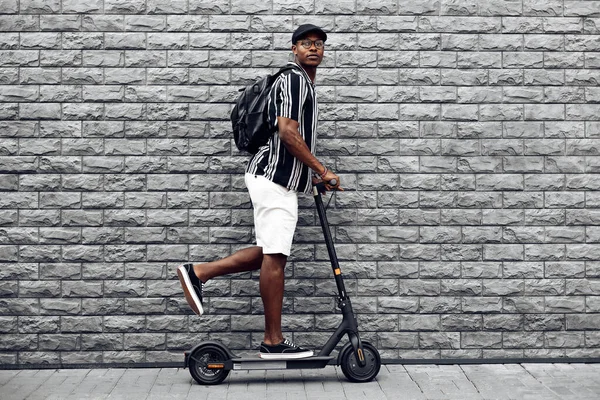 African American Man Scooter Black Brick Wall Background Guy Backpack — Stock Photo, Image