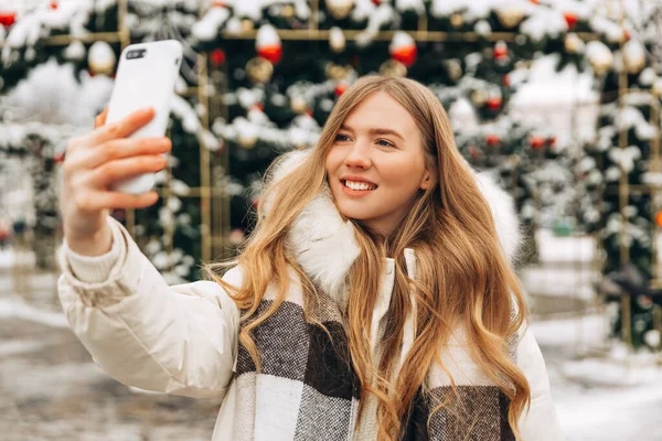Woman Warm Jacket Scarf Makes Selfie Emotionally Talks Mobile Phone — Fotografia de Stock