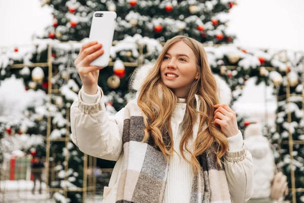 Woman Warm Jacket Scarf Makes Selfie Emotionally Talks Mobile Phone — Fotografia de Stock