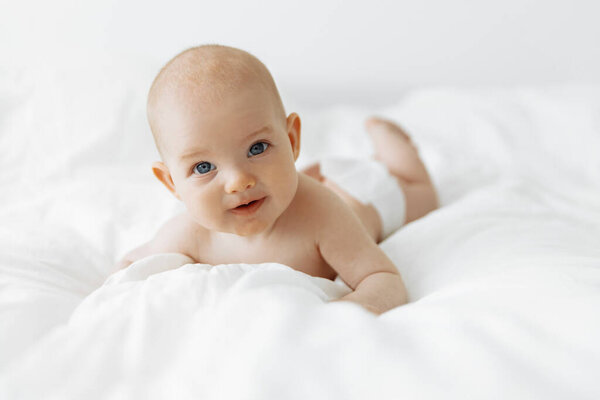 Smiling Newborn Baby White Bed Home White Sunny Bedroom Textiles Royalty Free Stock Images
