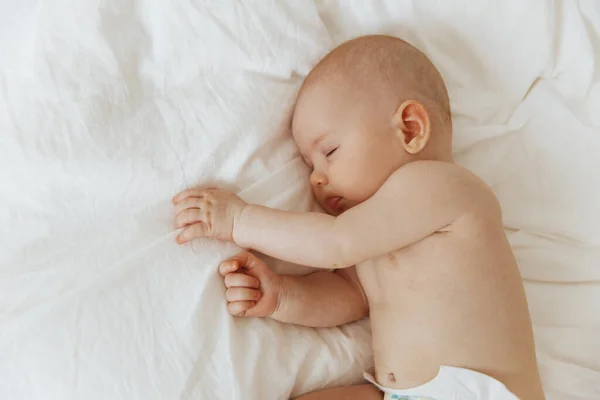 Beautiful Little Baby Sleeps Peacefully Lying His Side Bed Indoors Immagine Stock