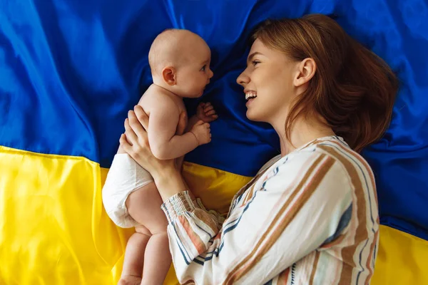 Loving Caring Mother Her Newborn Baby Lies Background Ukrainian Blue Immagine Stock