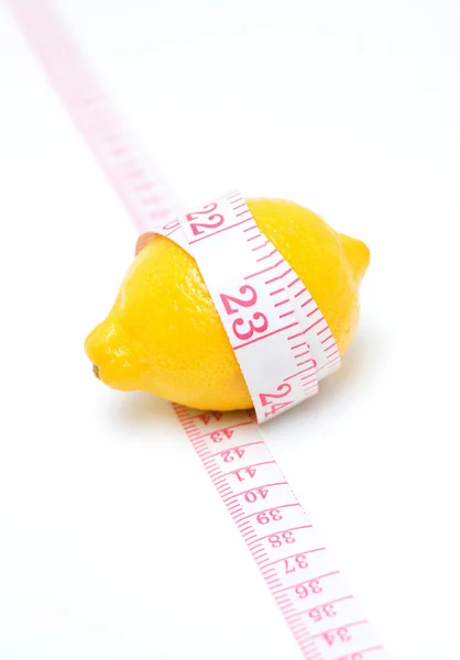 Lemon and Tape measures isolated on white background — Stock Photo, Image