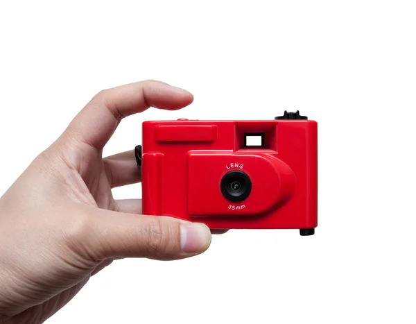 Kamera i en hand som isolerad på vit bakgrund — Stockfoto